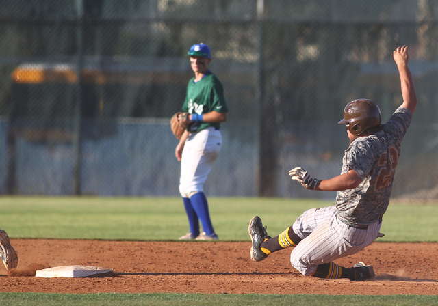 Bonanza’s Keith Werner (29) slides into second base against Green Valley on Friday. We ...