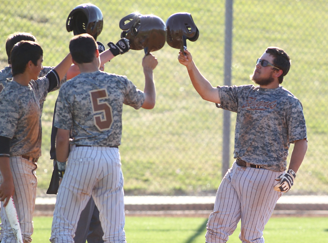 Bonanza’s Keith Werner, right, celebrates with teammates, after hitting a home run aga ...