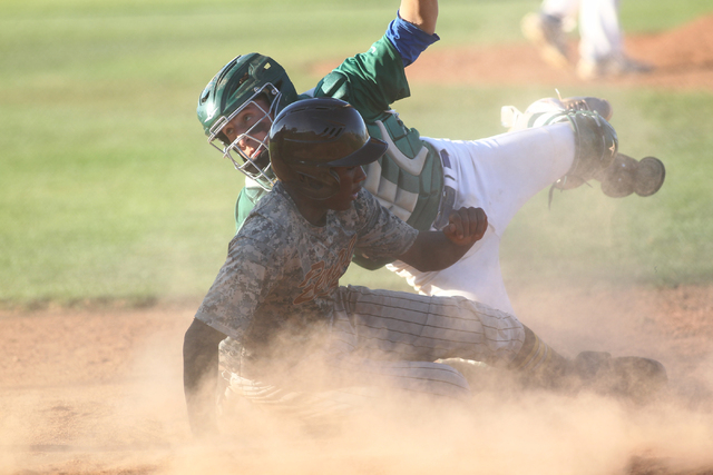 Bonanza’s Andre Isaraq (4) slides into home against Green Valley on Friday. (Chase Ste ...