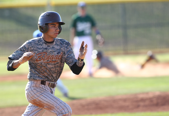 Bonanza’s Cruz Nevarez (2) runs for first base against Green Valley on Friday. (Chase ...