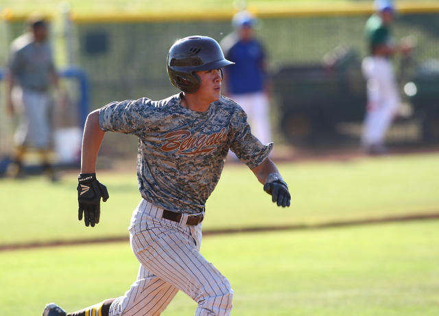 Bonanza’s Micah Higa (17) runs for first base against Green Valley on Friday. (Chase S ...