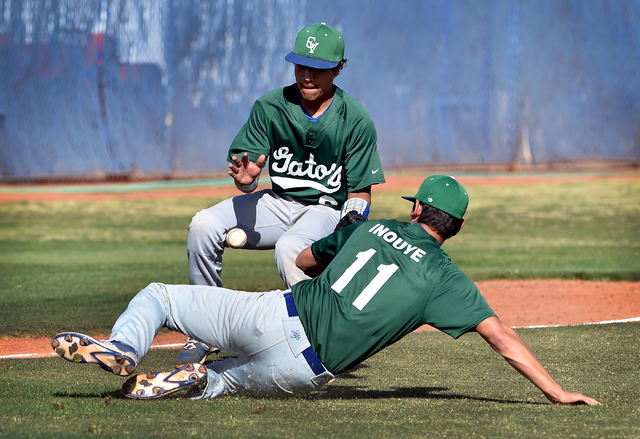 Green Valley’s Jimmy Montiel, left, and Blake Inouye chase an infield short hop during ...