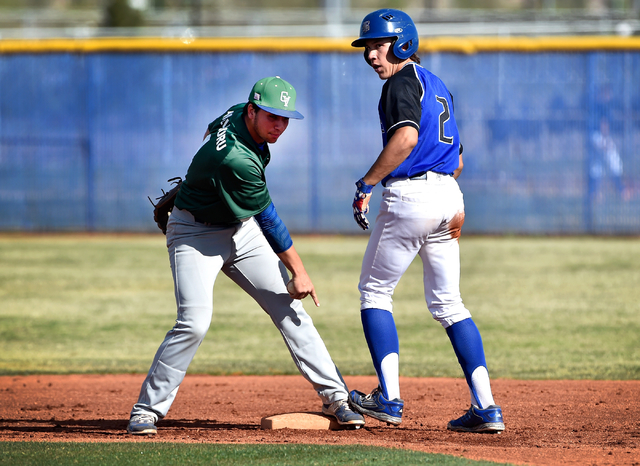 Green Valley’s A.J. Amelburu, left, points out Basic’s Cory Wills’ shoe on ...