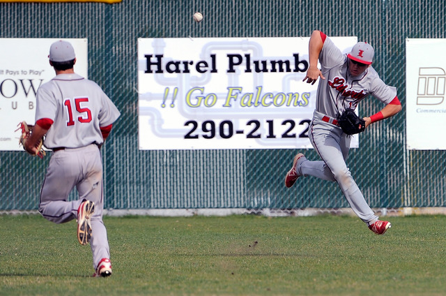 Liberty’s Ethan Ibarra (15) and Jesse Keiser chase a bloop hit against Foothill on Mon ...