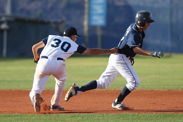 Centennial’s Travis Stevens (30) tags Chatsworth’s Jeryd Reuss (14) for an out i ...