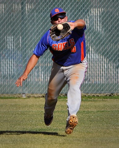 Bishop Gorman’s Brandon Wulff grabs a fly ball against Cimarron-Memorial on Monday. Go ...