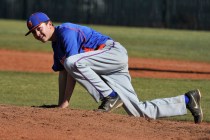 Bishop Gorman freshman left-hander Matt Mitchell manages a smile after being hit in the righ ...