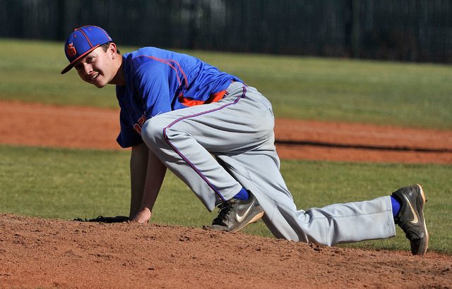 Bishop Gorman freshman left-hander Matt Mitchell manages a smile after being hit in the righ ...