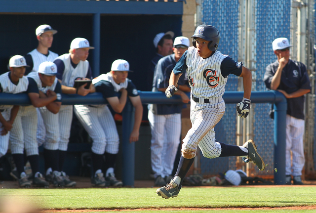 Chatsworth’s Garrett Kueber (4) runs for home plate to score in the first inning again ...