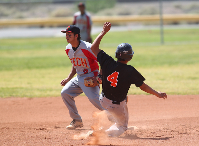 Chaparral’s Jose Ortiz (4) slides into second base as Tech’s Bryan Casas (2) wai ...