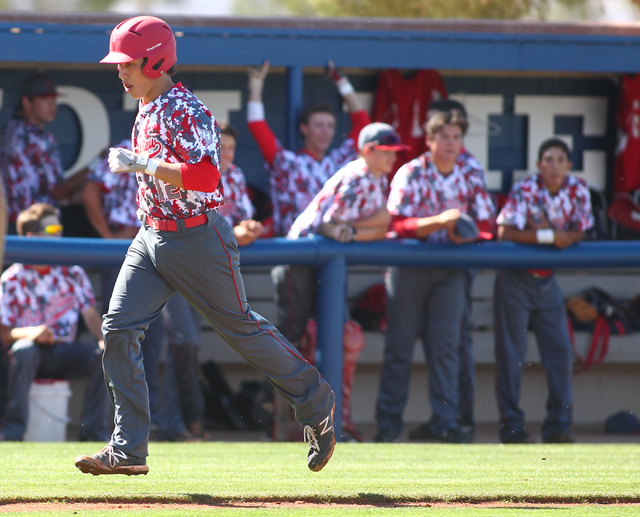 Arbor View’s Nick Quintana (12) heads for home plate after his solo homer in the first ...