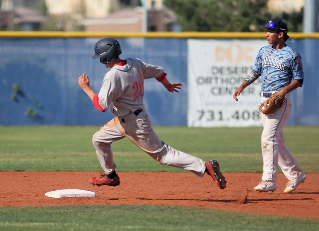 Coronado’s Anthony Olheiser, left, runs past Centennial’s Jaycob DelBarrio at se ...