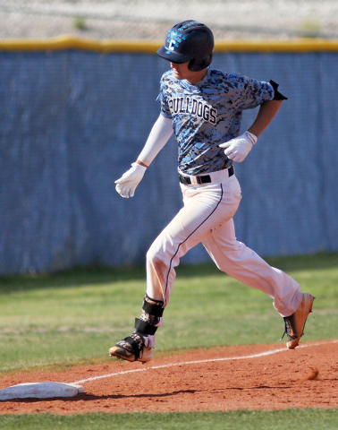 Centennial’s Jake Portaro reaches third base after hitting a home run during a basebal ...