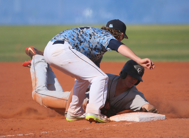 Centennials’ Jordon Wyke, left, tags out Coronado’s Jacen Yergensen at first ba ...