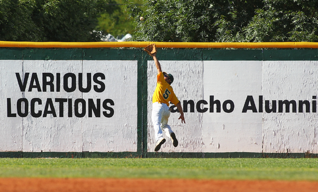 Rancho’s David Modler makes a leaping catch before slamming into the left-field wall d ...