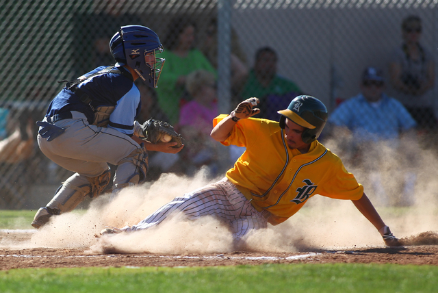 Rancho’s Braulio Santiaguin slides safely into home during the third inning Friday as ...