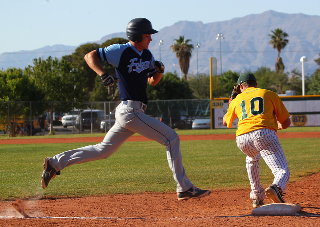 Foothill’s Jack Fredericksen, left, runs to first base as Rancho’s Josh Mill (10 ...