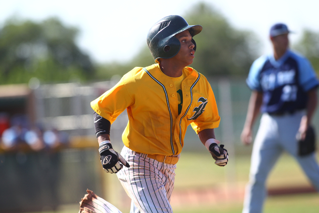 Rancho’s Bryce Harrell runs to first base after one of his four hits Friday. The Rams ...