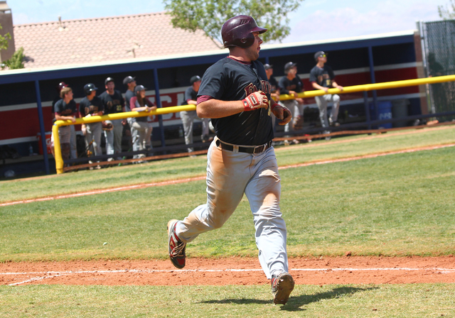 Faith Lutheran’s Dakota Greenawalt (18) heads towards first after belting a sixth-inni ...