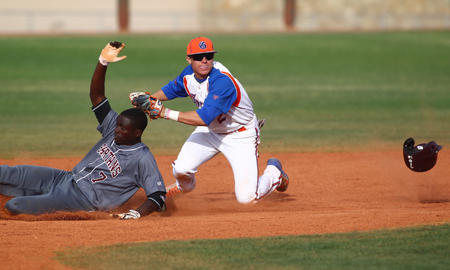 Bishop Gorman’s Cadyn Grenier (2) tags out Cimarron-Memorial’s Micquel Robinson ...