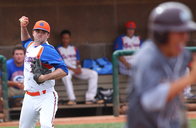 Bishop Gorman’s pitcher Bronson Bowe (13) looks to throw to first to out Cimarron-Memo ...