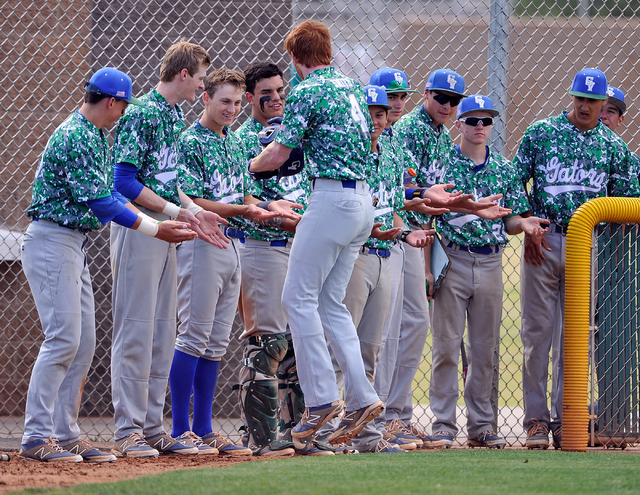 Green Valley’s Keaton Smith (4) celebrates with teammates after hitting a home run aga ...