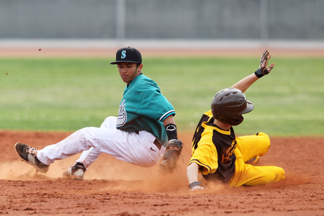 Bonanza’s Levi Klump slips into second with a stolen base behind Silverado’s Al ...