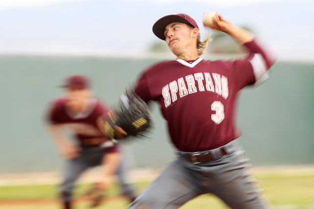 Cimarron pitcher Todd Danzeisen throws to Memorial Bonanza during their game April 10, 2015, ...