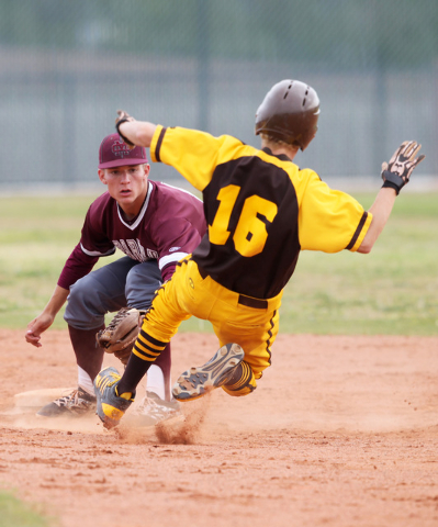 Cimarron Memorial’s Trent Bixby tags out Bonanza’s Levi Klump during their game ...