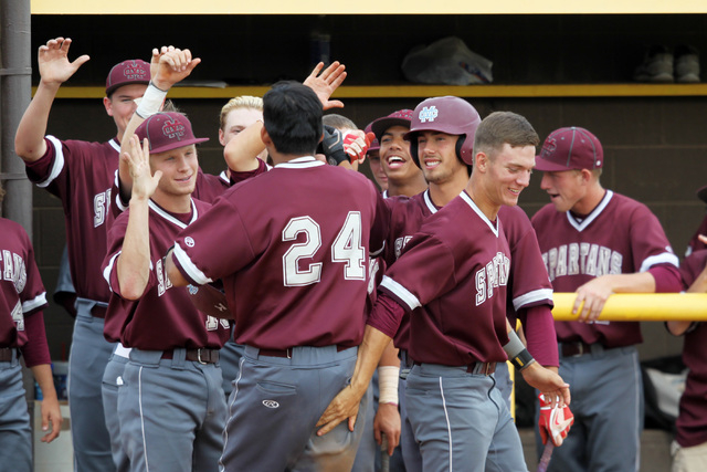 Cimarron Memorial’s Luis Flores is congratulated after his home run against Bonanza du ...