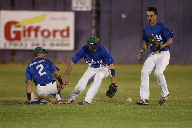 Green Valley center fielder Gavin Morley reaches for the ball after left fielder Jarod Penni ...