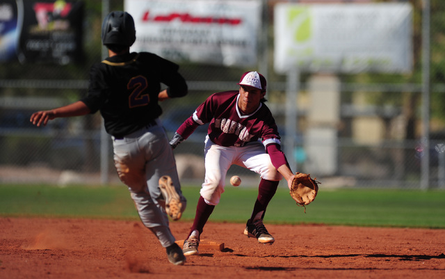 Durango base runner Duke Pahukoa steals second base while Cimarron-Memorial shortstop Jaret ...