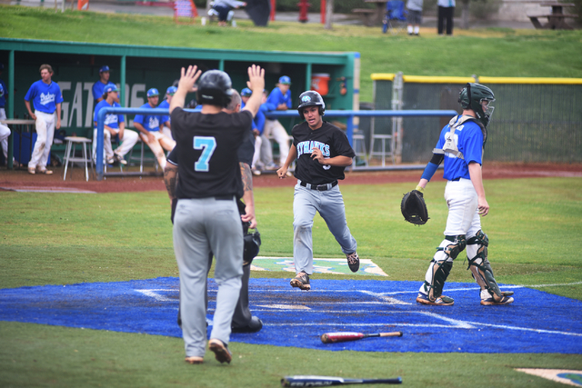 Silverado’s Justin DeLeon (5) scores a run against Green Valley during their baseball ...