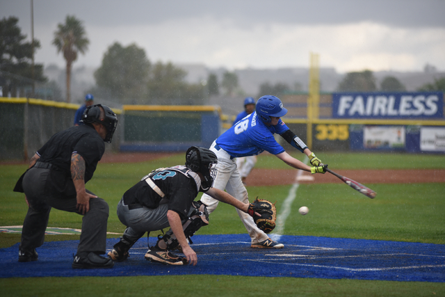 Green Valley’s James Leonard (28) swings at a strike against Silverado during their ba ...