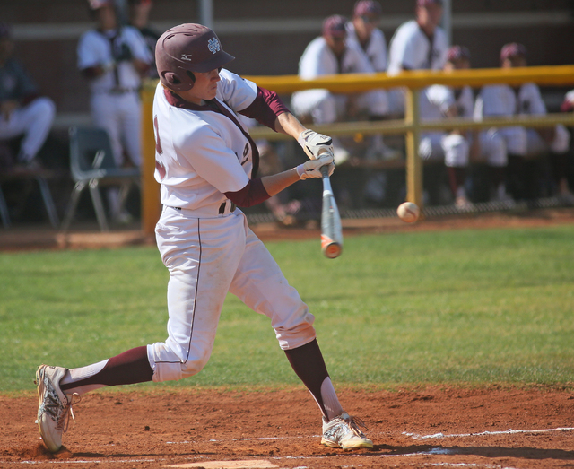 Cimarron-Memorial’s Trevor Lippard hits the ball during a baseball game against Arbor ...