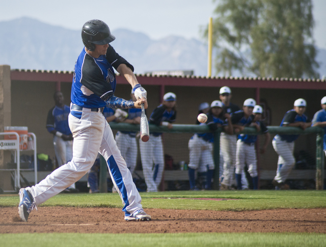 Basic’s Trent Bixby (26) hits the ball during the championship game of the Lions Kick ...