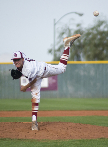 Desert Oasis pitcher Jason Sharman (15) throws the ball during the championship game of the ...