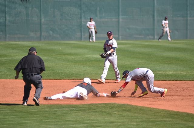 Bishop Gorman’s Mike Ruiz (3) is safe at second base while Liberty’s Lucas Bogue ...