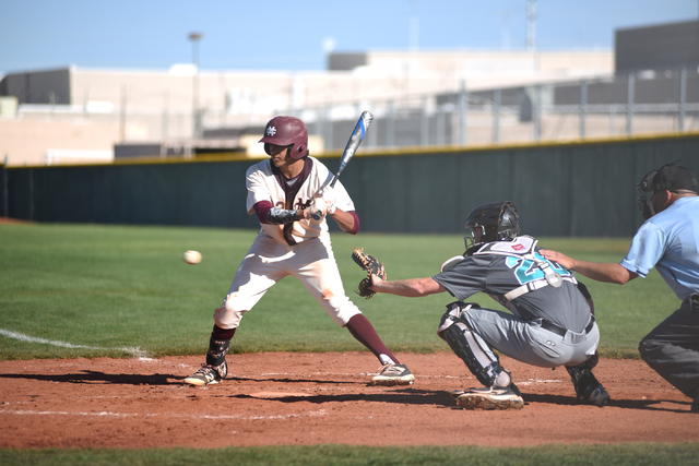 Cimarron-Memorial’s Jaret Godman (13) looks at a pitch against Silverado during their ...