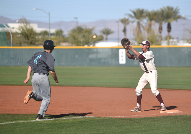 Cimarron-Memorial’s Luis Flores (24) catches the ball for an out against Silverado&#82 ...