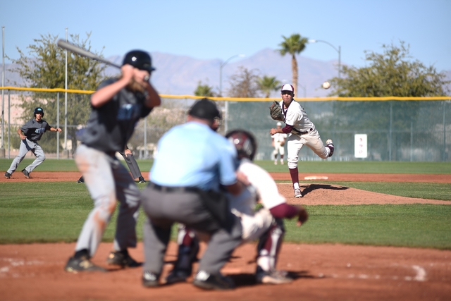 Cimarron-Memorial’s Luis Flores (24) pitches against Silverado during their game playe ...