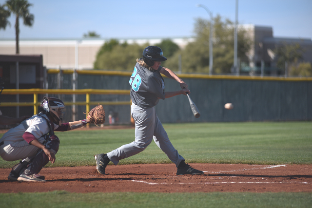 Silverado’s Kevin Pindel (28) hits the ball against Cimarron-Memorial during their gam ...