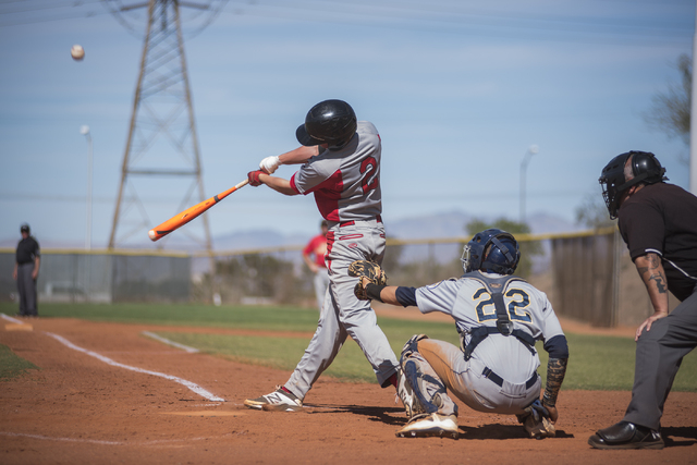 Tech’s Trevor Kephart (2) makes contact with the ball against Boulder City during thei ...