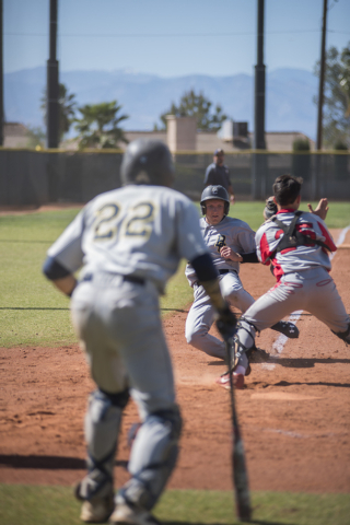 Boulder City’s Seth Kermode (10) scores at home before being tagged by Tech’s ca ...