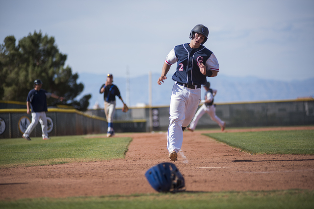 Coronado’s Corben Bellamy (2) scores a run against Basic during their baseball game at ...