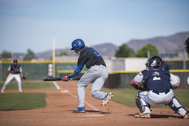 Basic’s Cory Wills (2) bunts the ball against Coronado during their baseball game at C ...