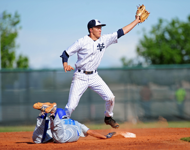 Sierra Vista base runner Jhared Gonzalez slides back to second base after Spring Valley shor ...