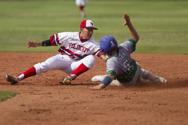 Las Vegas Jared Herrera (8) tags out Green Valley’s Eric Faber (5) in second base duri ...