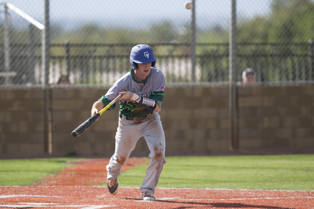 Green Valley’s Frankie Fitzgerald (3) bunts the ball for an out against Las Vegas in t ...