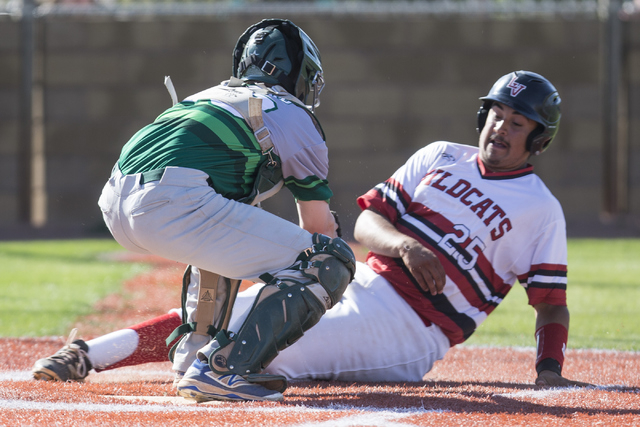 Green Valley’s Jake Leonard (28) tags out Las Vegas Antonio Gaxiola (25) at home plate ...